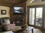 Gas fireplace, Smart TV and entrance to front porch